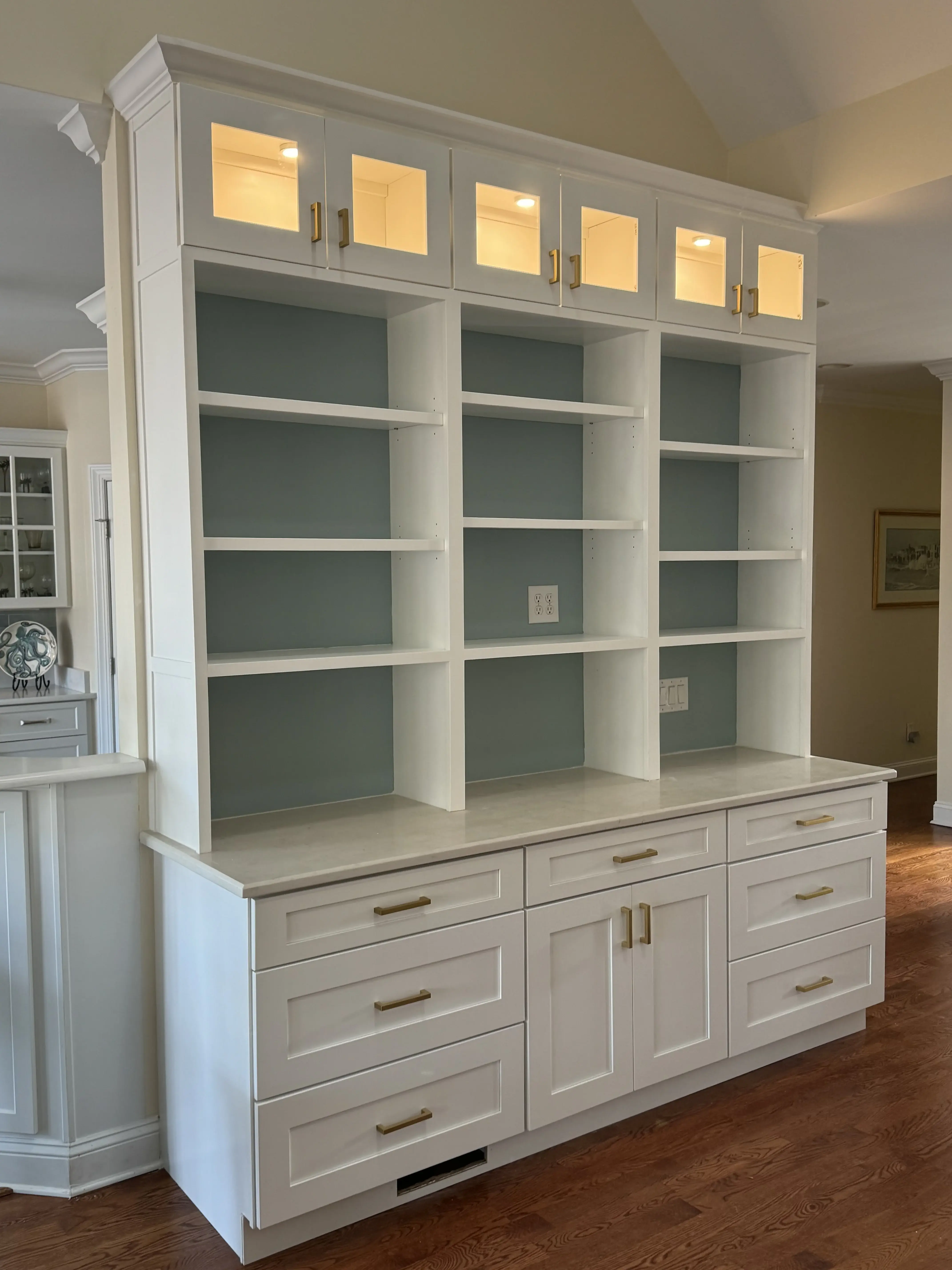 Custom built-in cabinetry with styled shelving after renovation