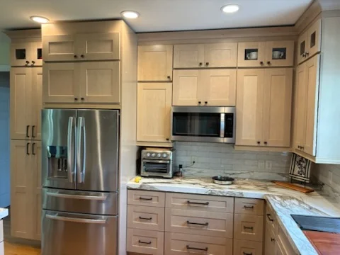 Kitchen remodel with floating shelves and statement range hood